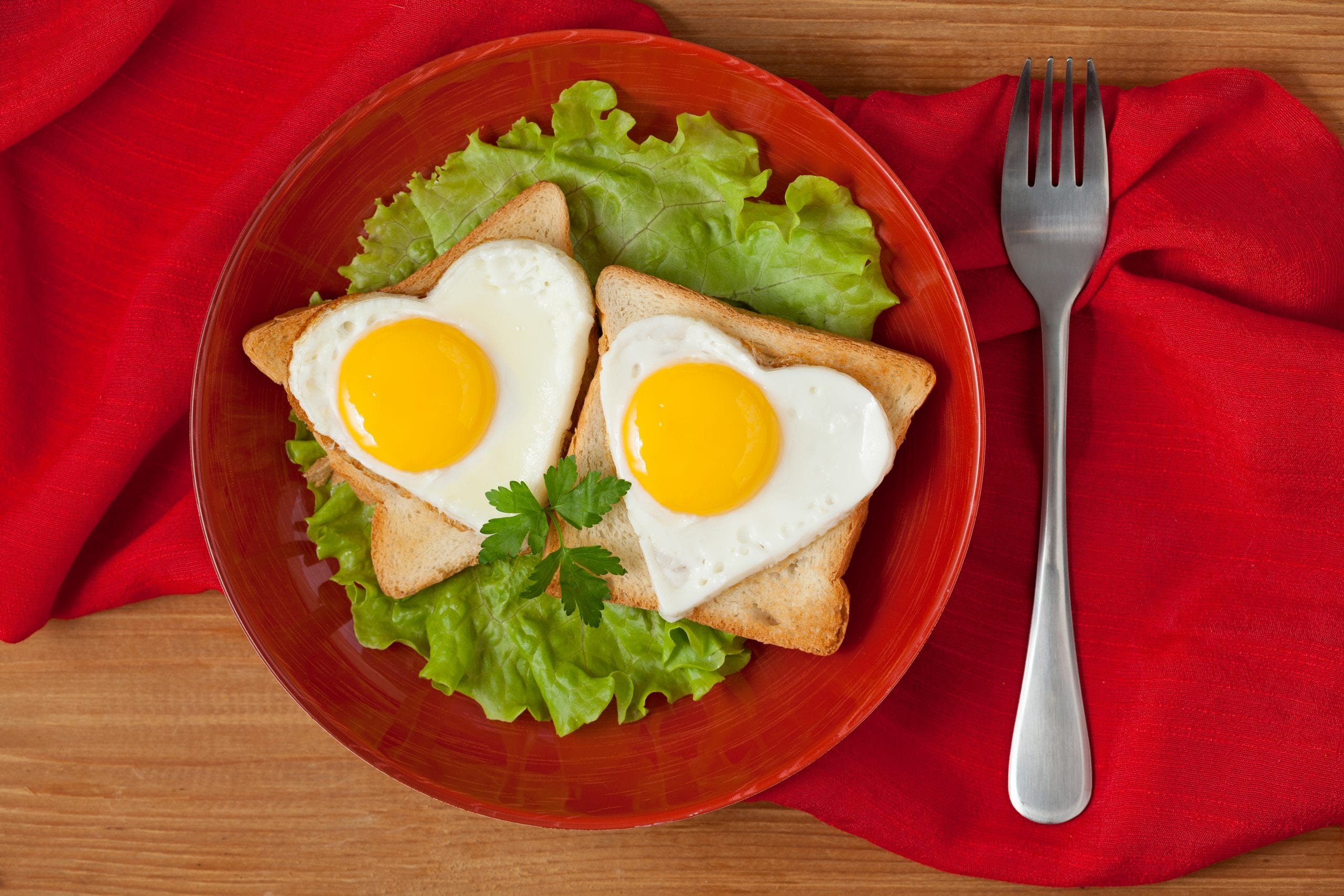 Two heart shaped fried eggs