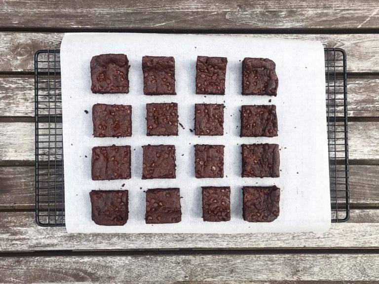 gluten free chocolate peanut butter brownies sliced on parchment paper