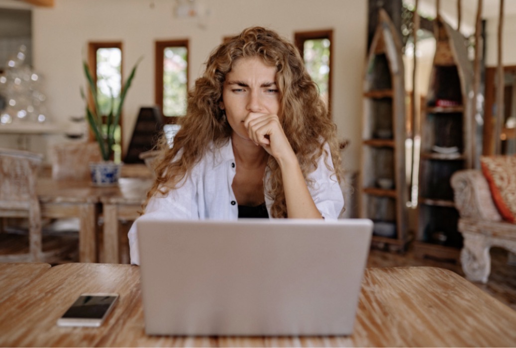 Woman holding normal lab results and still feeling exhausted