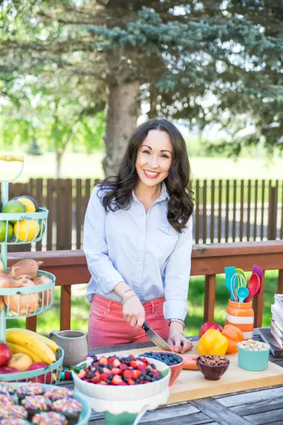 Amanda at picnic table with healthy food